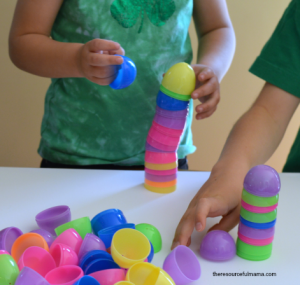 child building with easter eggs