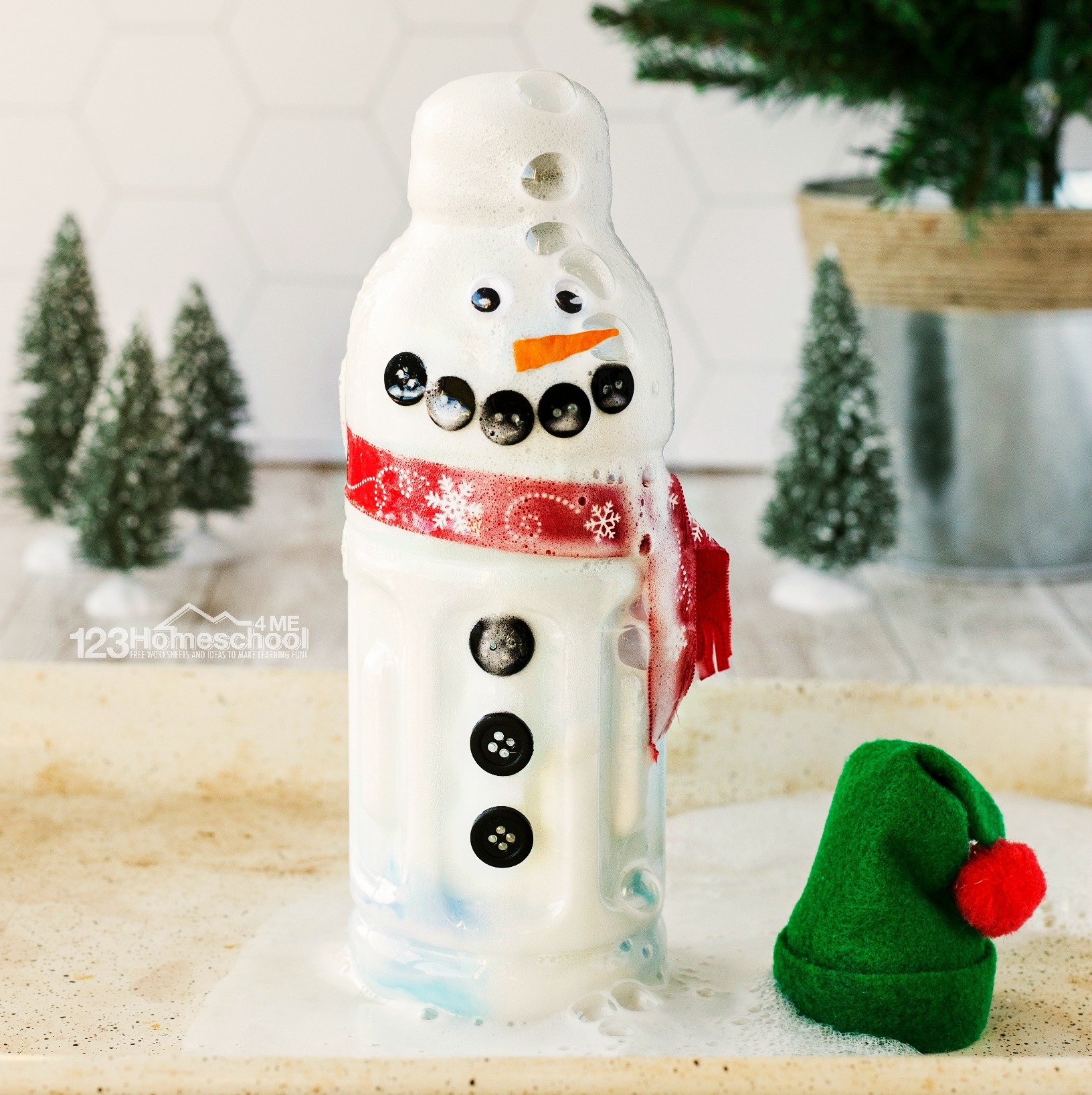 baking soda and vinegar reacting to create an exploding snowman