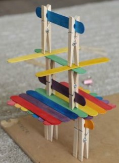 structure with popsicle sticks and clothespins
