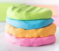 green, blue, orange, and pink cloud dough