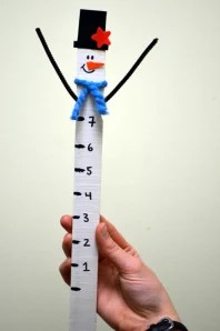 Snowman snow measuring stick