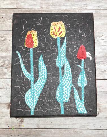 Colorful tulip artwork on black canvas