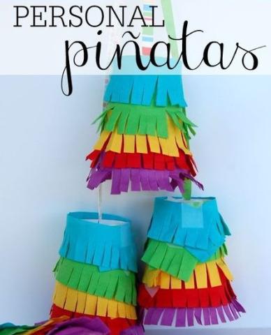Colorful piñatas made from a cup and tissue paper