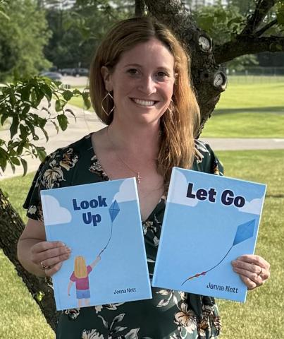 Author Jenna Nett with books Look Up and Let Go