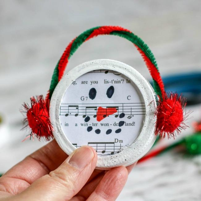 snowman made out of a mason jar lid