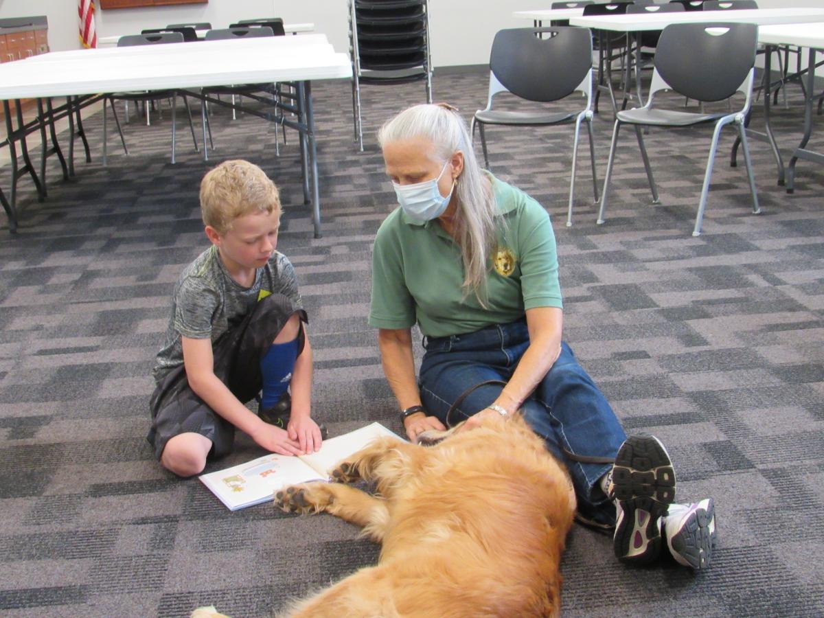 boy reading to dog