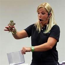 lady in black shirt holding frog