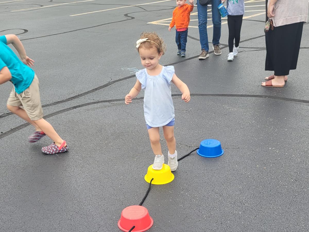 girl doing an obstacle course